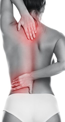 Woman with pain in her back on white background